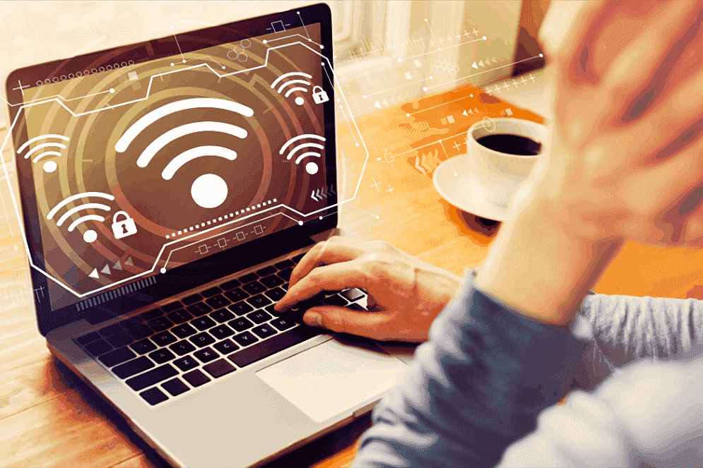 a person uses a laptop with a WiFi signal on the screen