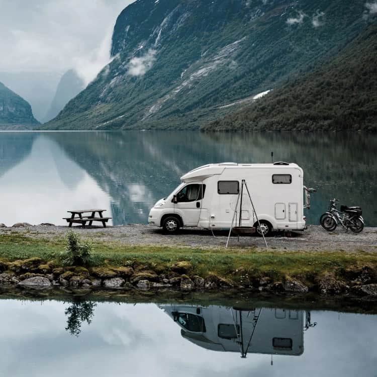 family eating outside rv
