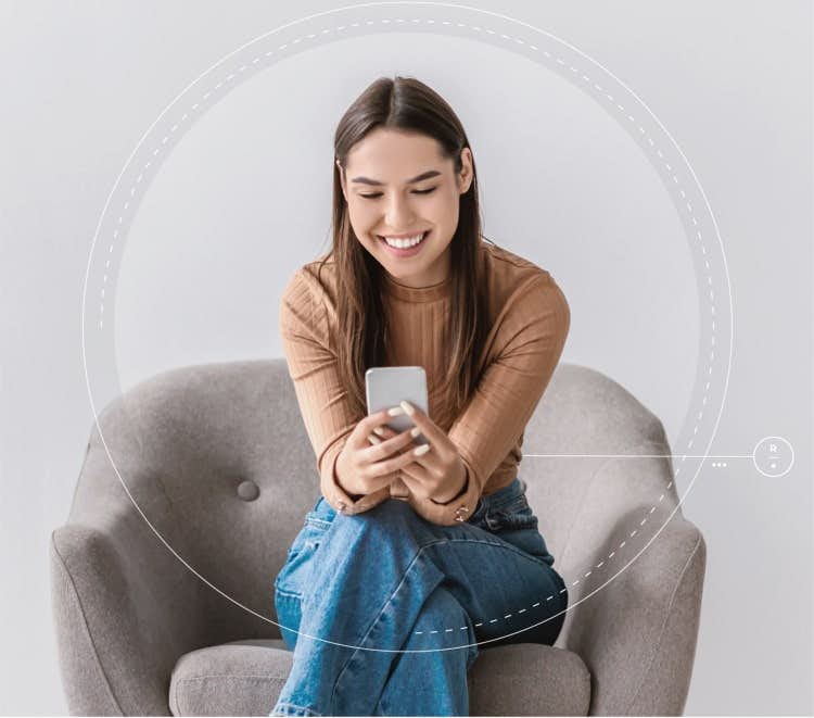 woman on couch holding phone