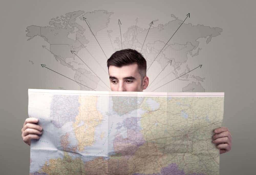 young man holding a map