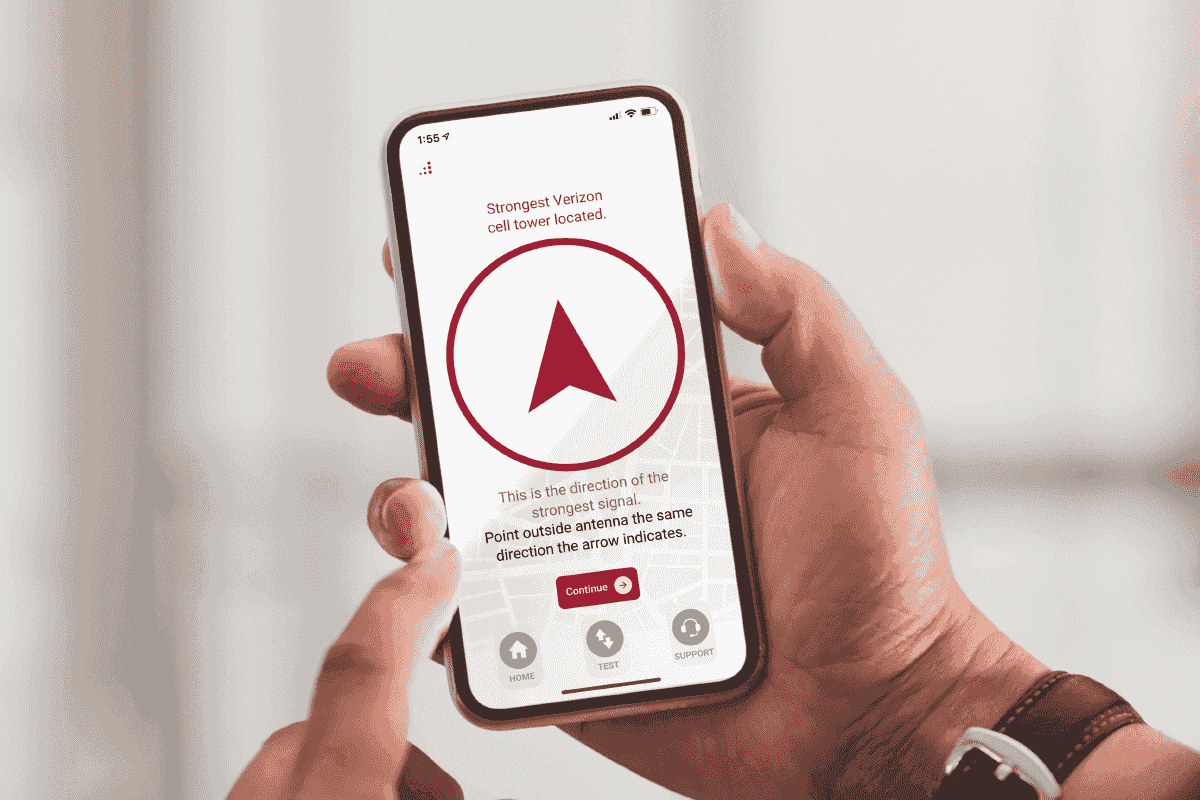 man using weBoost mobile app to find cell tower